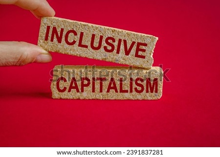 Inclusive capitalism symbol. Concept red words Inclusive capitalism on brick blocks. Beautiful red background. Business inclusive capitalism concept. Copy space.