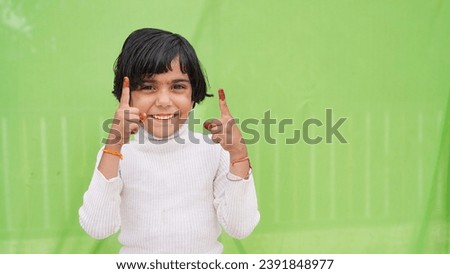 Smiling happy funny girl wear casual orange turtleneck point index finger camera on you say do it motivate isolated on light green color background studio portrait