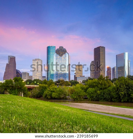 Houston, Texas  skyline at sunset twilight from park lawn