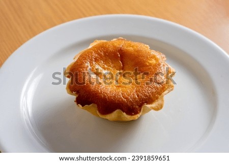 Traditional Évora's Queijada: A delectable Portuguese pastry boasting a creamy cheese filling in a crispy crust. Authentic and irresistible delight! Royalty-Free Stock Photo #2391859651