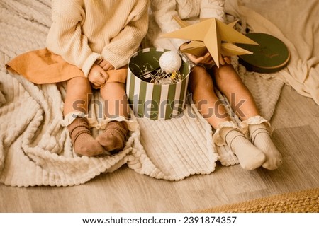 Children's feet in beautiful socks in a New Year's atmosphere 
preparation for the holiday