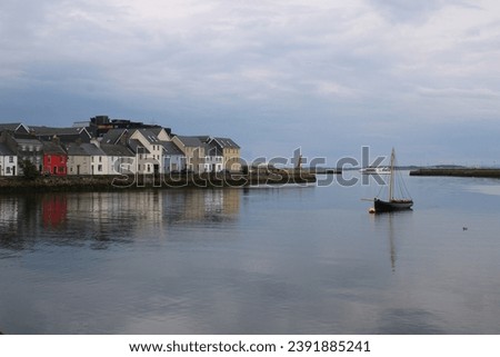The stunning view of reflection on the lake in Galway colourful houses