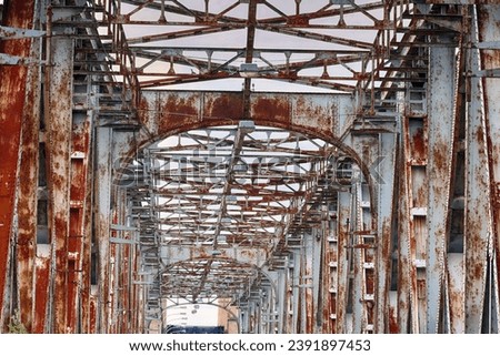 Old steel railway bridge disused and rusty. Royalty-Free Stock Photo #2391897453
