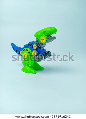 Dinosaur assemble toy on soft green background