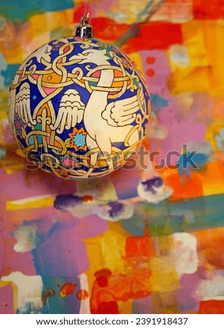 Hand-painted Christmas ball with Russian dragons in the Renaissance style. Decoration for the Year of the Dragon.