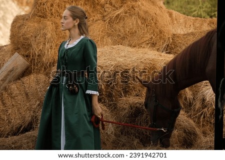 woman taking photos in period costumes