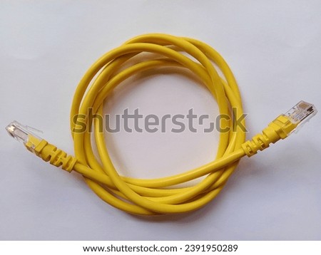 Stock photo of yellow internet cable isolated on white background