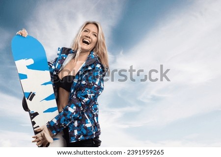 Positive beautiful young girl with snowboard