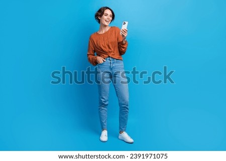 Full size photo of young woman instagram twitter facebook telegram funny post wear trendy brown clothes isolated on blue color background