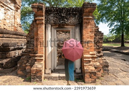 female tourist Stand and look at the beauty. Si Thep Historical Park New World Heritage Site, Si Thep District, Phetchabun Province, Thailand. Royalty-Free Stock Photo #2391973659