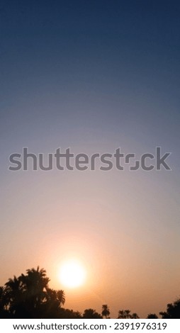 Stunning Sunset Overlooking Serene Landscape - Creative and Beautiful View Stock Photo best for your Sunset Collection.