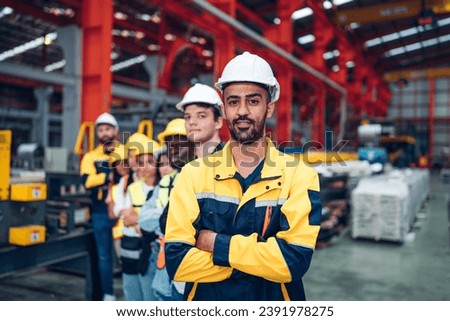 Team and portrait of engineering employees standing in an industrial manufacturing factory. , Working together, Coordination and Teamwork concept. Royalty-Free Stock Photo #2391978275
