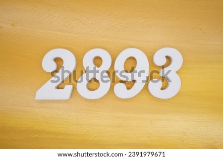 The golden yellow painted wood panel for the background, number 2893, is made from white painted wood.