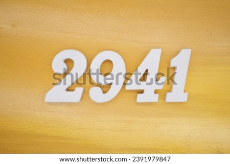 The golden yellow painted wood panel for the background, number 2941, is made from white painted wood.