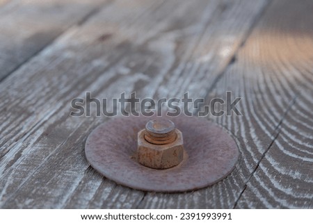 rusty metal bolt. rusty metal bolt and nut on wooden surface