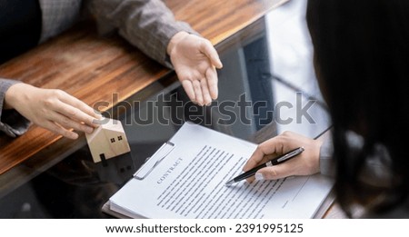 Business people signing contract making deal with real estate agent Concept for consultant home insurance
Real estate investment Property insurance security