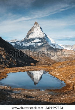 Beautiful landscape of Riffelsee lake and Matterhorn iconic mountain reflection in the morning at canton of Valais, Switzerland Royalty-Free Stock Photo #2391997323