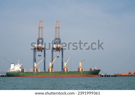crane loading cargo container from truck to container ship in the international terminal logistic sea port concept freight shipping by ship, webinar banner forwarder mast	

