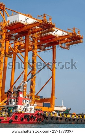 crane loading cargo container from truck to container ship in the international terminal logistic sea port concept freight shipping by ship, webinar banner forwarder mast	

