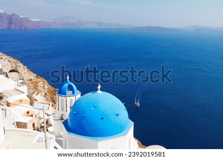 view of caldera with blue church domes and blue sea, Oia, Santorini, web banner format