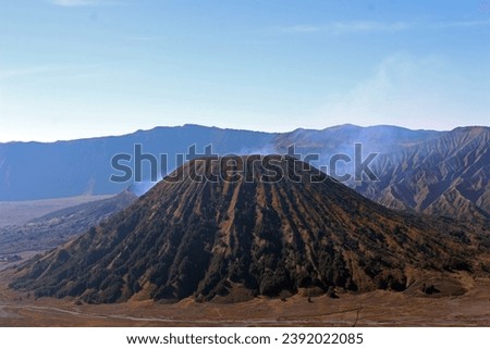 Mount Batok under the blue sky, an inactive cinder cone volcanoe at the west side of Mount Bromo.