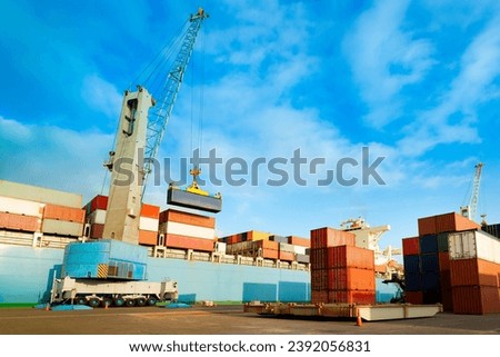Cargo ship being loaded with containers at port in Chile