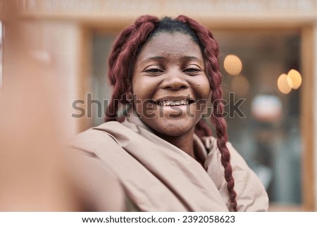 African american woman smiling confident making selfie by camera at street