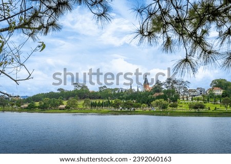 Morning view of a Da Lat City with development buildings, transportation, market. Tourist city with center square of Da Lat city near Xuan Huong lake Royalty-Free Stock Photo #2392060163