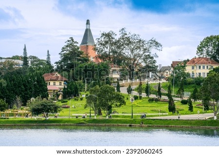 Morning view of a Da Lat City with development buildings, transportation, market. Tourist city with center square of Da Lat city near Xuan Huong lake Royalty-Free Stock Photo #2392060245