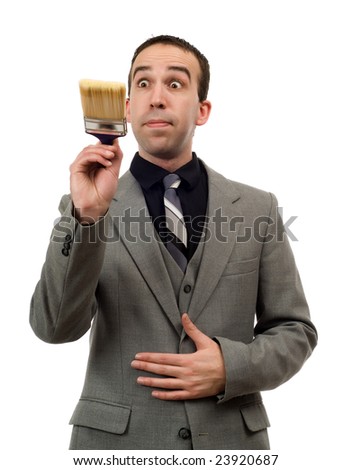Front view of a businessman painting something in front of him, isolated against a white background