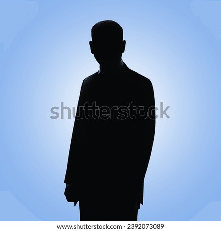 Man's silhouette. Businessman's profile picture. Man posing in suit on blue background Royalty-Free Stock Photo #2392073089