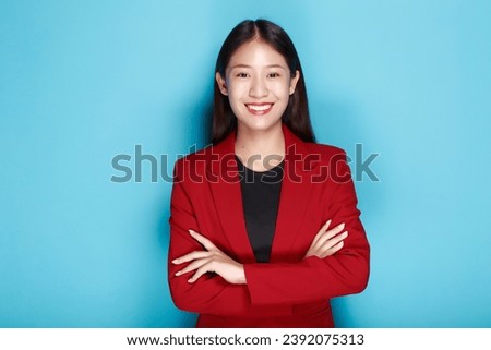 Portrait of a friendly young woman smiling happily, Portrait of a beautiful young woman in a light blue background, half body photo of nice positive lady crossed arms posing empty space ad isolated.