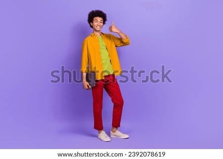 Full length photo of satisfied cheerful man office worker recommend remote work isolated on purple color background Royalty-Free Stock Photo #2392078619
