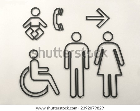 Men and women signs for restroom on modern stone wall background. Toilet sign concept.