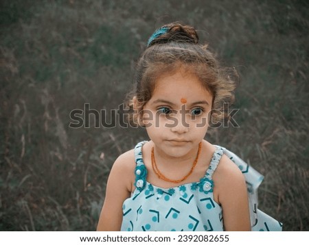 Ai photo best editing with portrait little girl image.Different filter effect in garden photo.Wearing black eyeglass and white dress.