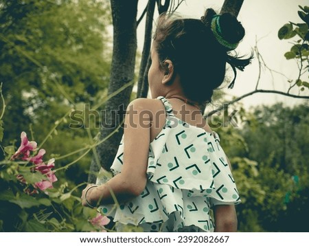Ai photo best editing with portrait little girl image.Different filter effect in garden photo.Wearing black eyeglass and white dress.