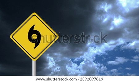 Hurricane season with symbol sign against a stormy background and copy space. dirty and angled sign adds to the drama. hurricane sign, hurricane season sing on cloudy background