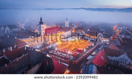 Sibiu, Transylvania. Morning picture taken from aerial drone flight, Large Square and Christmas Market, famous winter fair in Romania.