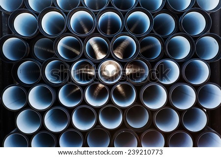 background of colorful big plastic pipes used at the building site. Royalty-Free Stock Photo #239210773