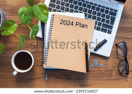 Note book with 2024 goals text on it to apply new year resolutions and plan. Royalty-Free Stock Photo #2392116027