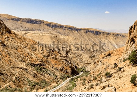 Road among mountains, rocks, cliffs