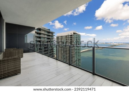 Contemporary Balcony Photoshoot located in Florida, USA. Showcasing modern architectural design and development. Beautiful clear Skyline with Sunset and commercial area view.