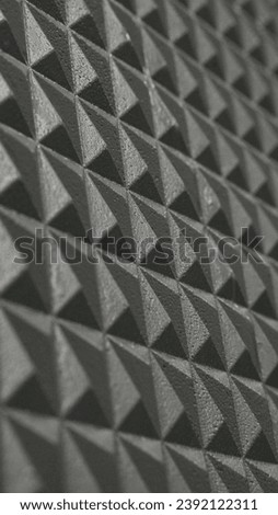 Triangle shaped wall texture shot from close distance.
