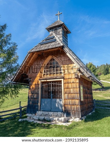 Chapel of the Queen Mary of Peace on the Uskovnica mountain meadow on Pokljuka Royalty-Free Stock Photo #2392135895