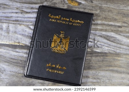Egyptian passport black book, Translation of Arabic words (Arab republic of Egypt's passport) with the republican golden eagle on its cover, A black passport cover to protect the passport ID