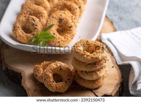 Turkish Bagel with sesame seeds or salty ring cookies. Turkish name; Kandil simidi or tuzlu halka kurabiye Royalty-Free Stock Photo #2392150473
