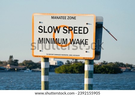 A sign warning boaters to slow down as they are entering a manatee zone in Clearwater, Florida.