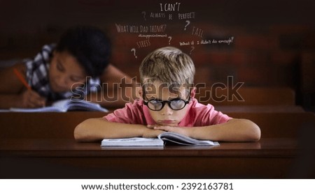 Confused and struggling to learn - Learning disabilities. Young boy feeling overcome with boredom in the classroom. Royalty-Free Stock Photo #2392163781