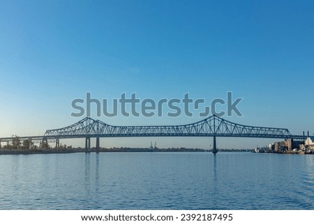 scenic morning view to Crescent City Connection bridge spanning the Mississippi river in New Orleans, USA