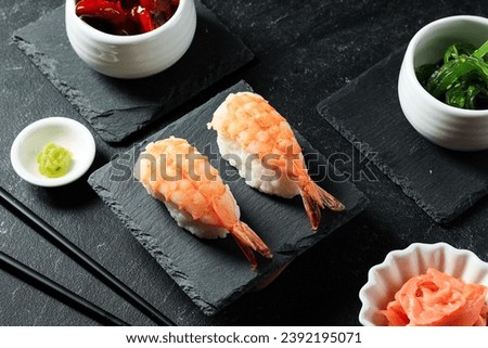 Ebi Nigiri Sushi or Shrimp Nigirizushi, Cooked Japanese Rice, Kome, with Toppings of Fresh Cooked Shrimp Prawn. Royalty-Free Stock Photo #2392195071